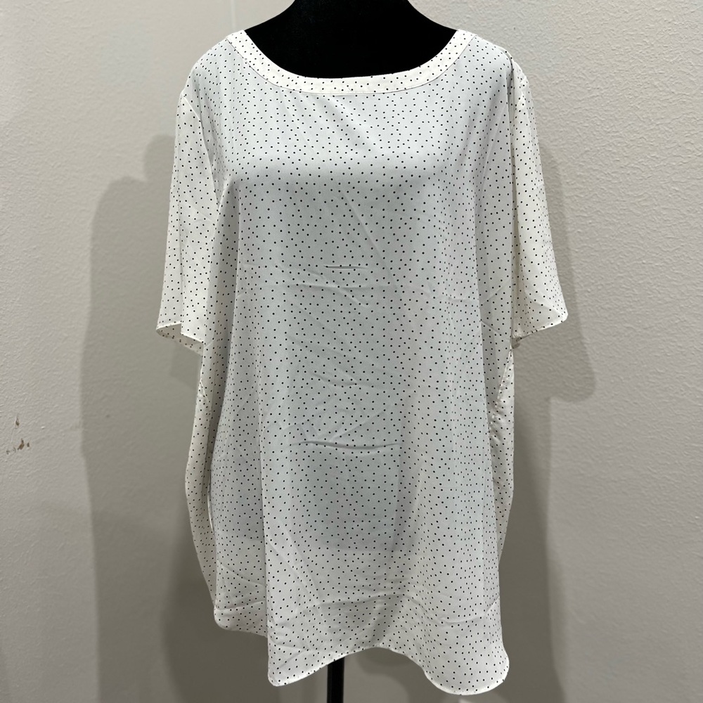 Creamy whitete with tiny black polka dots closet staple